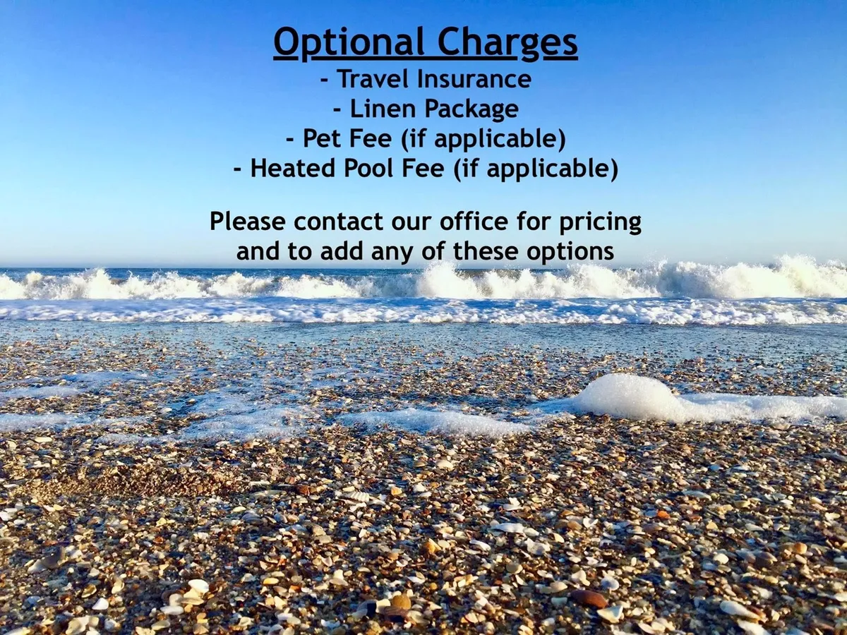 A tranquil stretch of North Topsail Beach with gentle waves lapping the sandy shore beneath a clear blue sky. Children can be seen building sandcastles and families stroll along the waterline, collecting seashells.